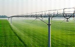 Icon of an irrigation sprinkler system in a green field